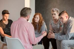 Addiction counselor and his patients