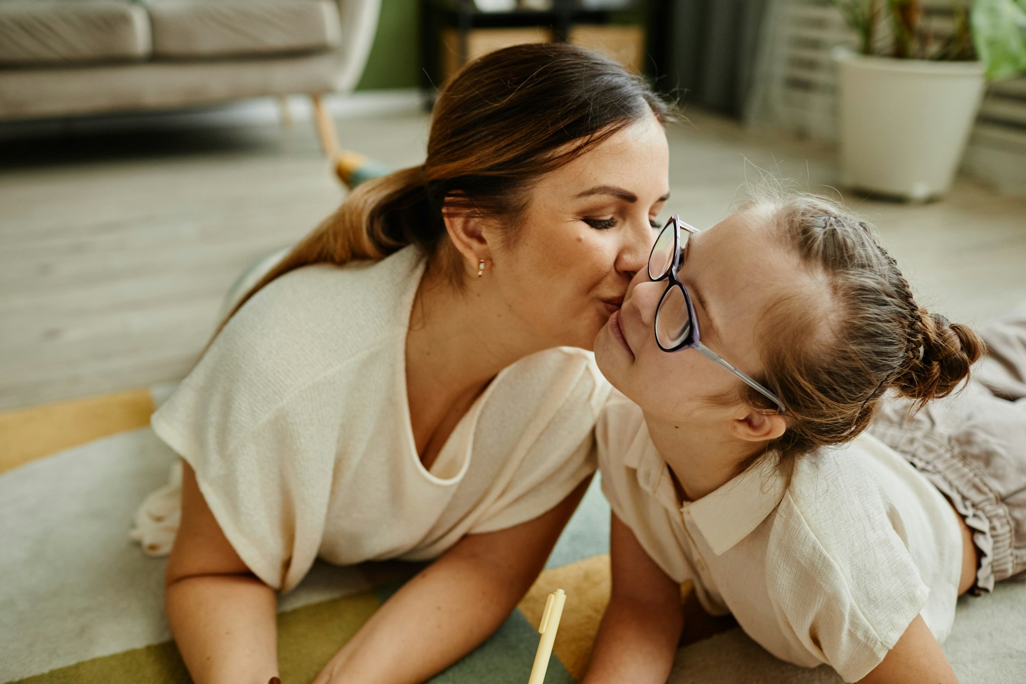 Mom Kissing Daughter with Down Syndrome