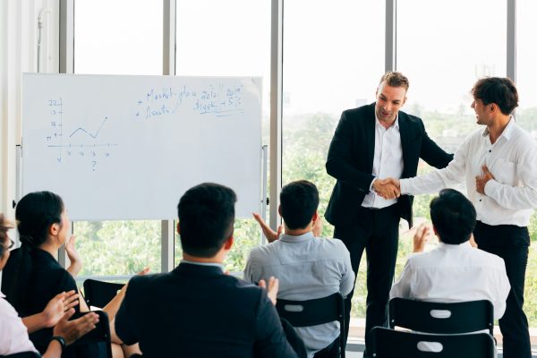 New employee introduced by business manager in seminar