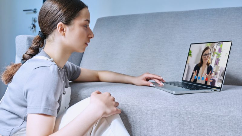 Young female on online therapy session with psychologist